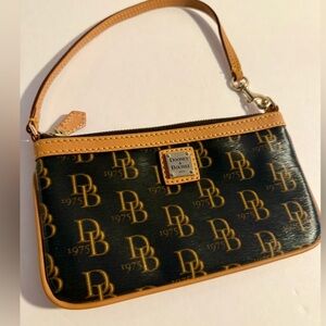 Like new Dooney & Bourke Black and Tan Wristlet